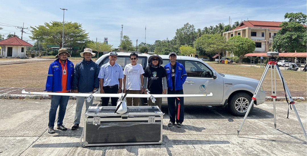 Systronics engineers and Rubber Authority of Thailand officers pose with the JOUAV CW-15 VTOL drone during field deployment in Narathiwat Province